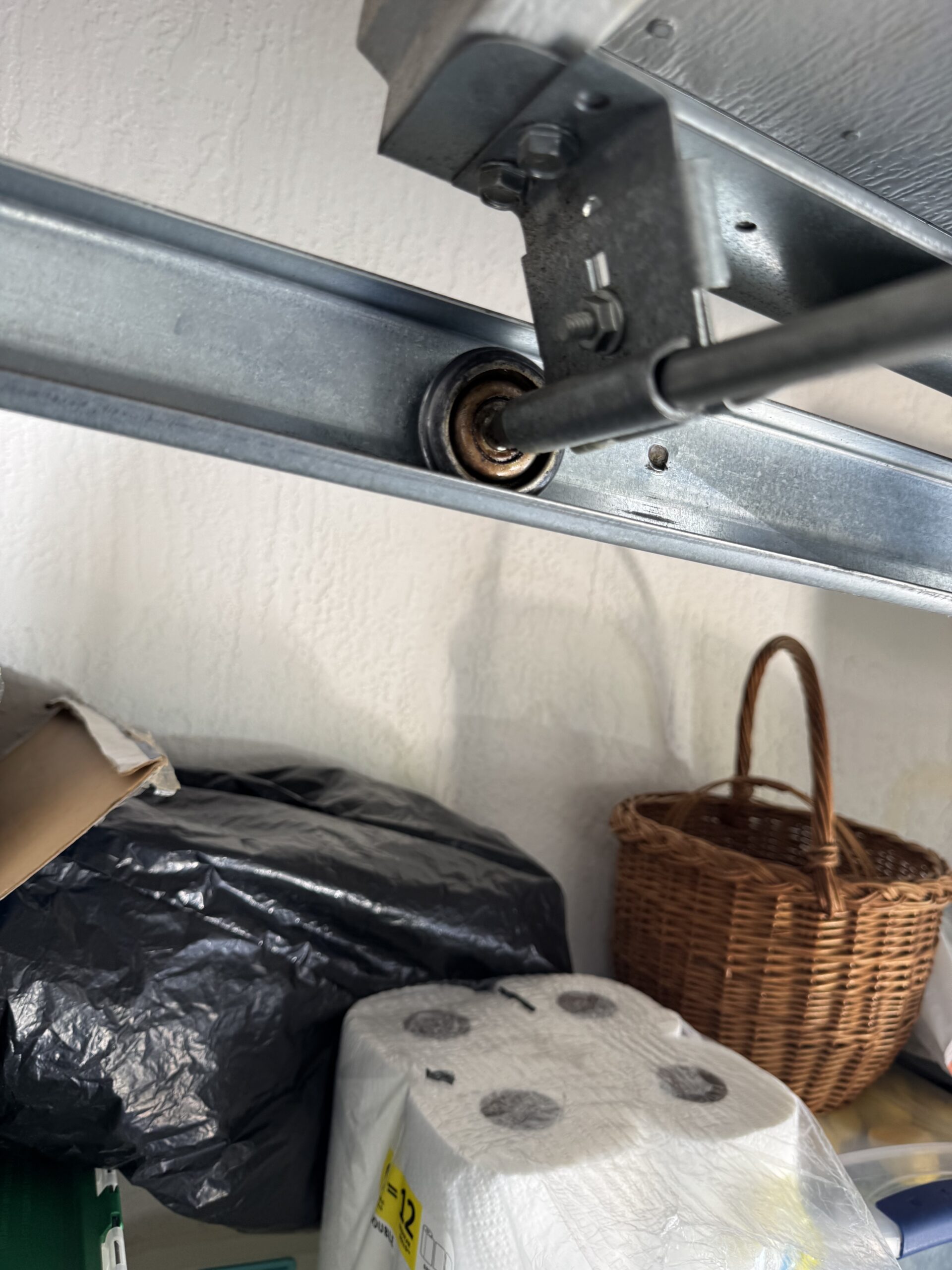 Worn garage door roller inside track before replacement in Ocala FL